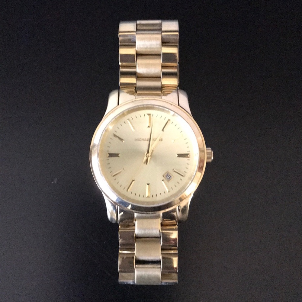 Michael Kors “Runway” bracelet watch in gold.